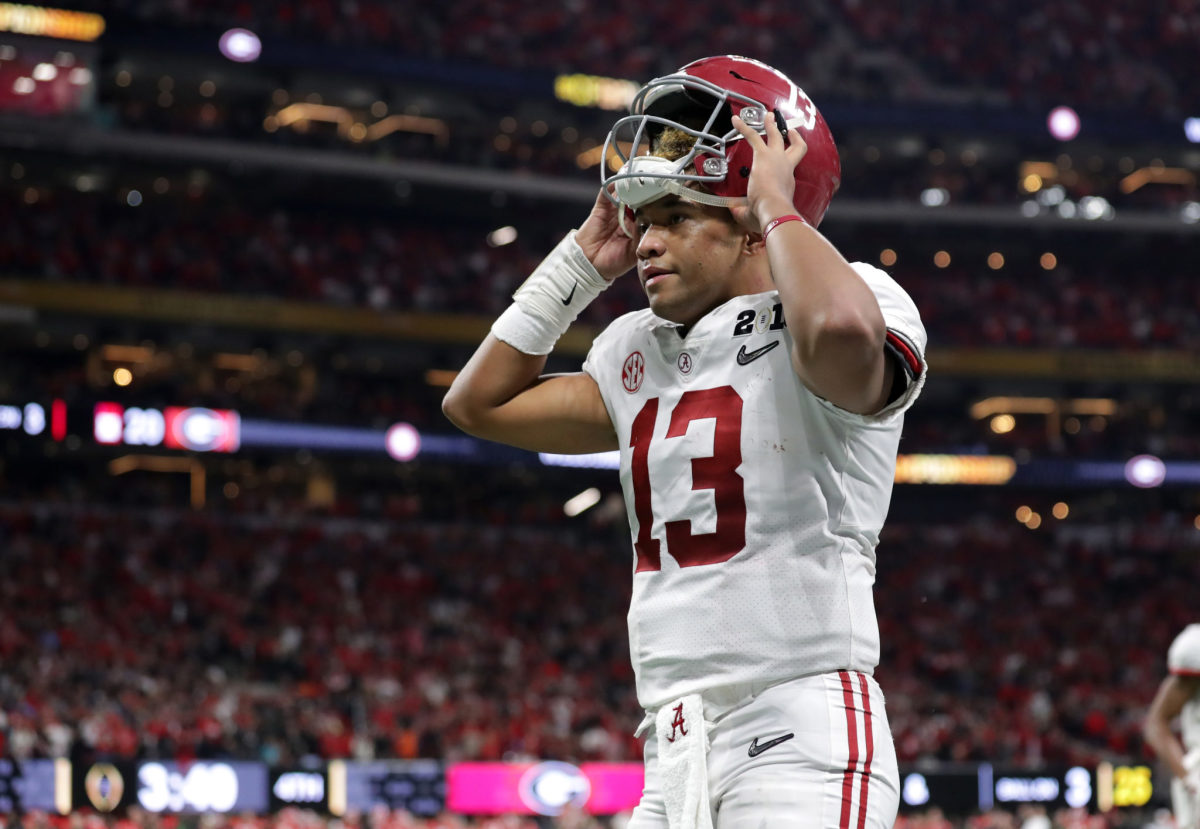 Tua Tagovailoa of the Alabama Crimson Tide reacts to throwing a seven yard touchdown pass during the fourth quarter against the Georgia Bulldogs.