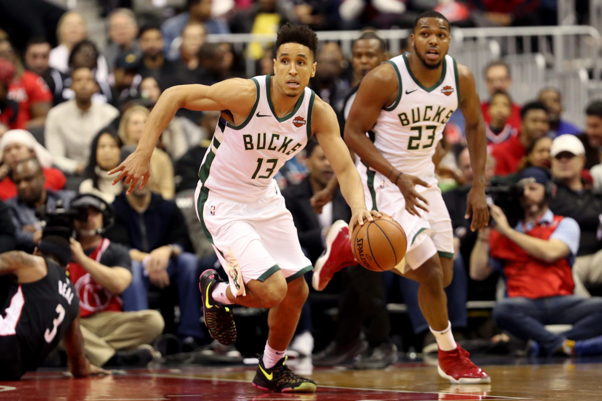 Malcolm Brogdon dribbling up the court.