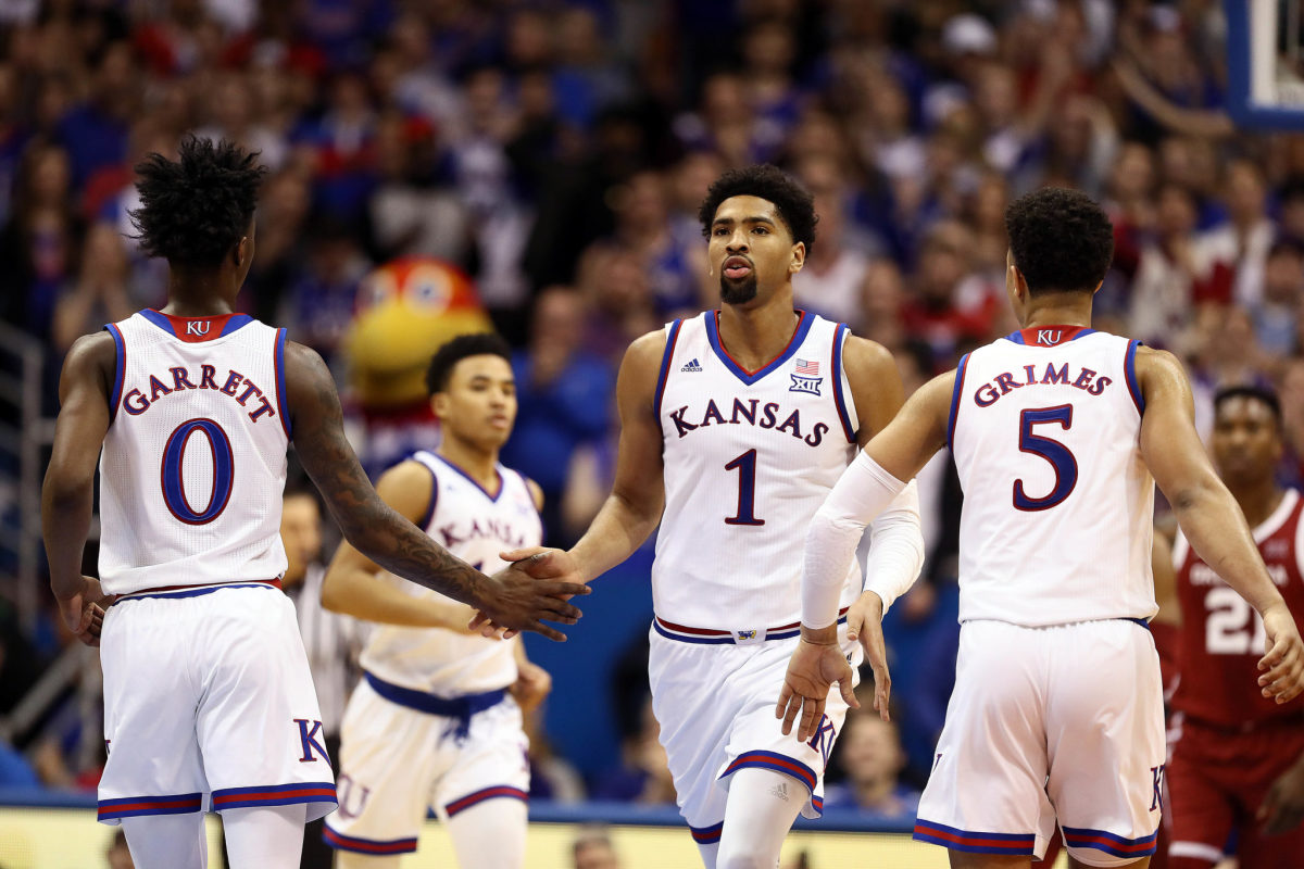 Dedric Lawson of the Kansas Jayhawks is congratulated by teammates after scoring against the Oklahoma Sooners.