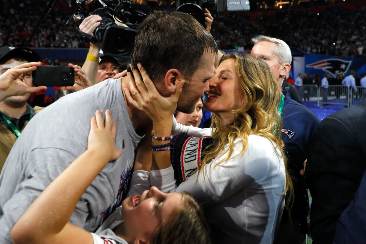 tom brady and his wife, gisele, celebrate after the super bowl