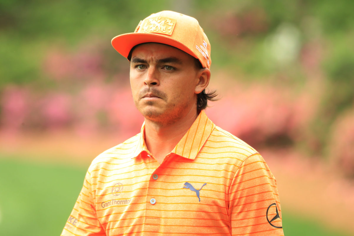 A closeup of Rickie Fowler on the golf course.