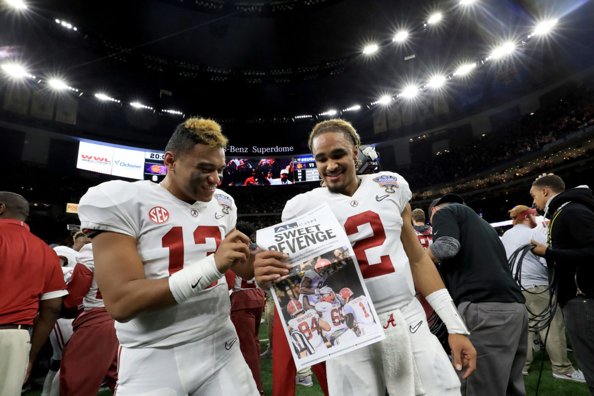Jalen Hurts of the Alabama Crimson Tide and Tua Tagovailoa #13 celebrate after winning the AllState Sugar Bowl against the Clemson Tigers.