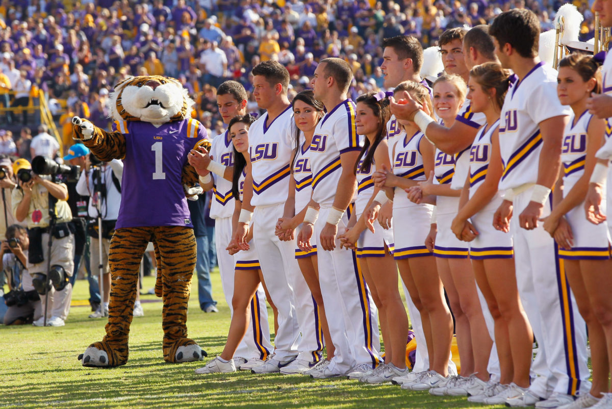 The LSU cheer squad lined up next to the Tigers mascot.