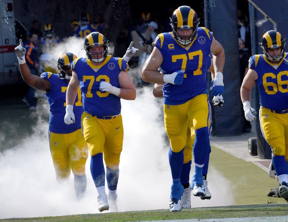 Los Angeles Rams tackle Andrew Whitworth runs onto the field.