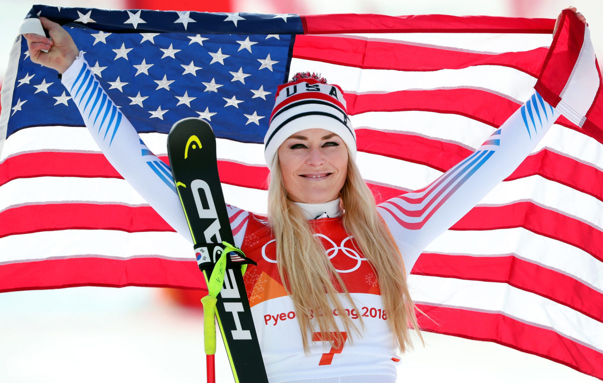 Bronze medallist Lindsey Vonn of the United States celebrates during the victory ceremony for the Ladies' Downhill.