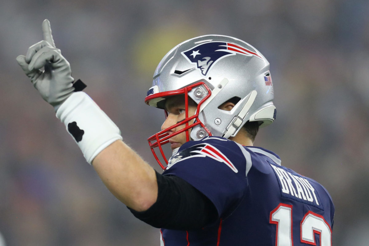 Tom Brady points to the stands during the Patriots' Wild Card game.