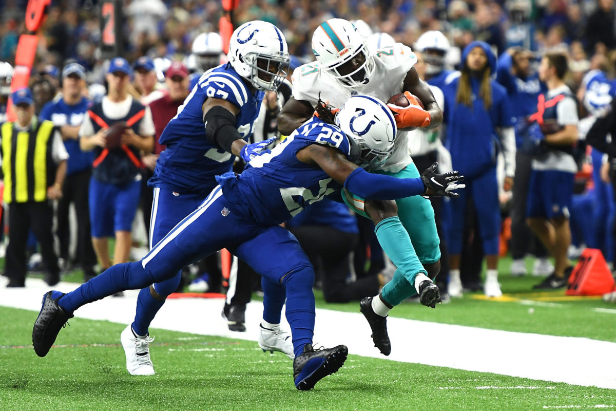 Malik Hooker makes a tackle in an NFL game for the Indianapolis Colts.