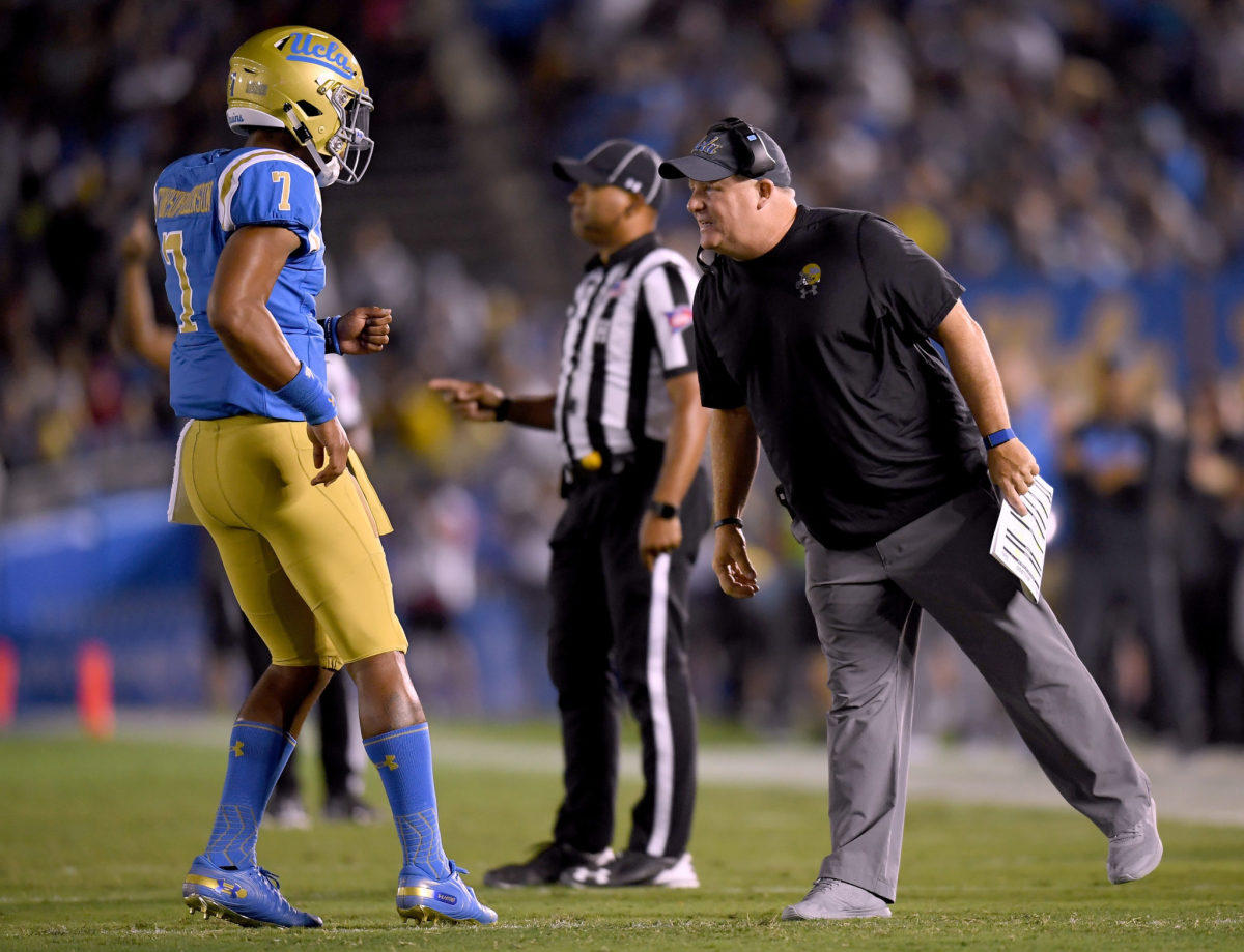 UCLA coach Chip Kelly talking to his quarterback.