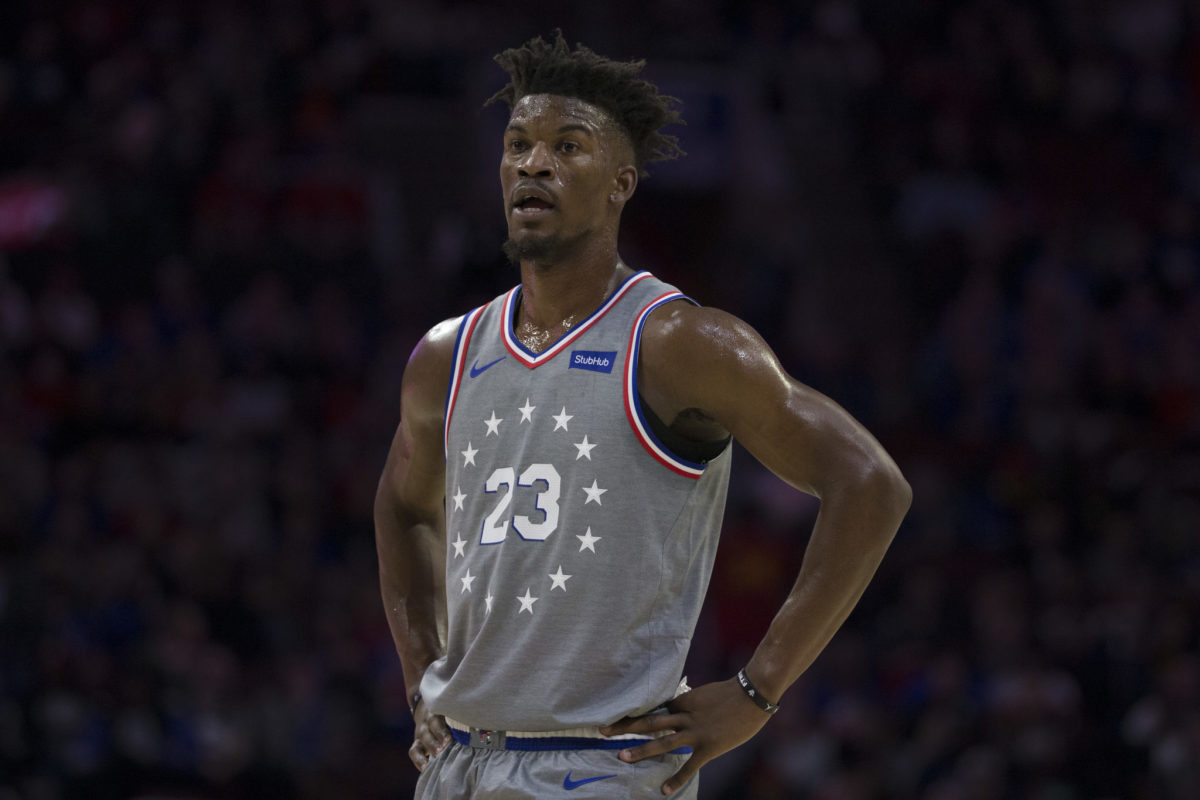 Jimmy Butler standing with his hands on his hips during a game.