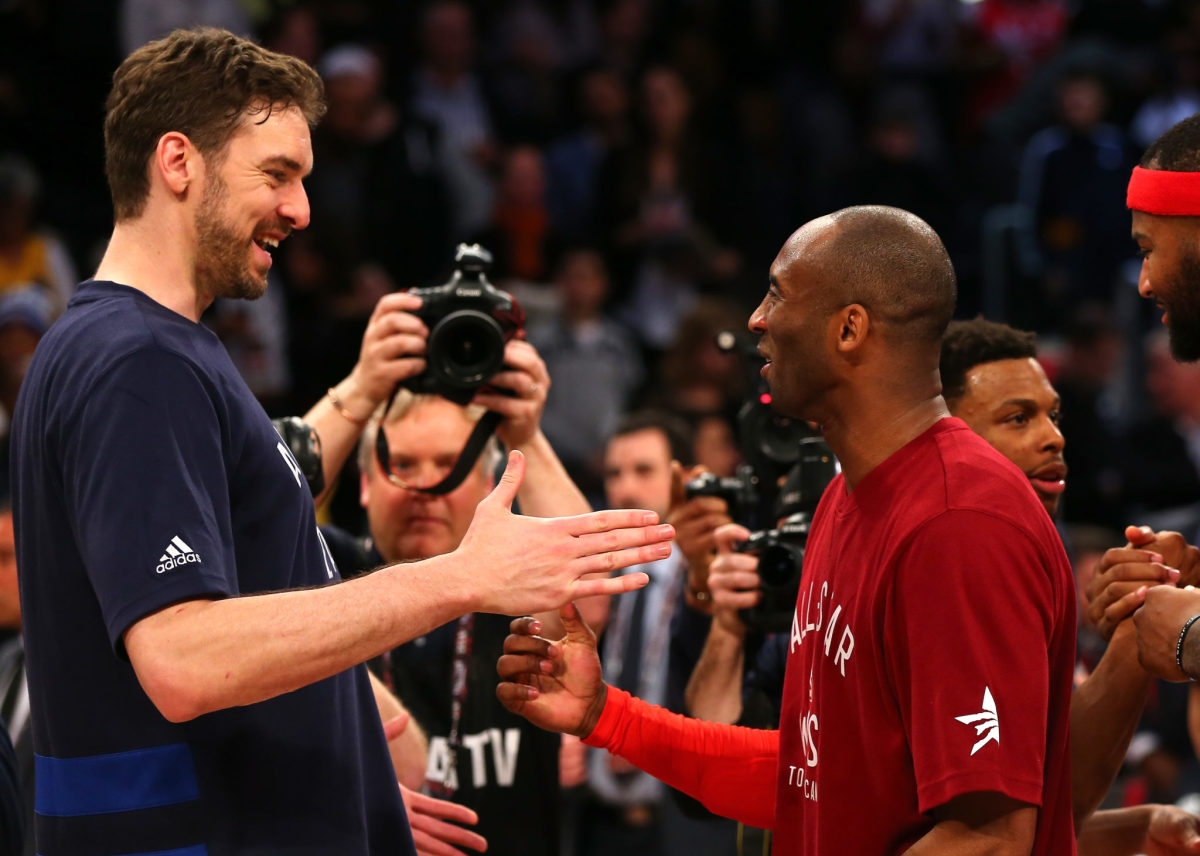 Pau Gasol and Kobe Bryant shake hands before the All-Star Game.