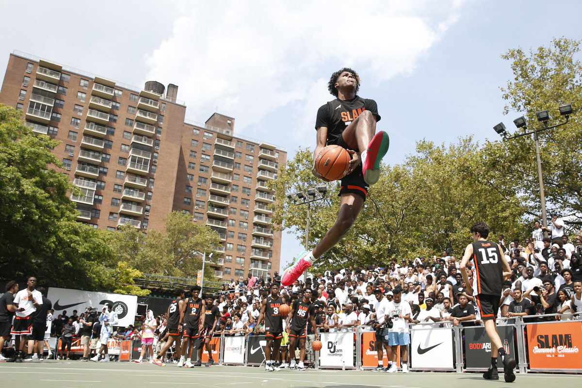Recruit Jalen Green skies for a dunk at the SLAM Summer Classic in New York.