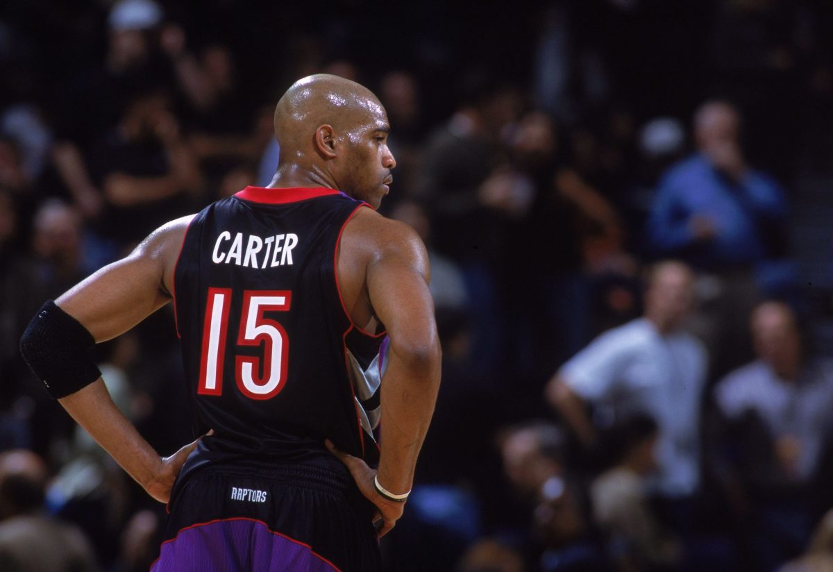 vince carter looks onto the court during a game