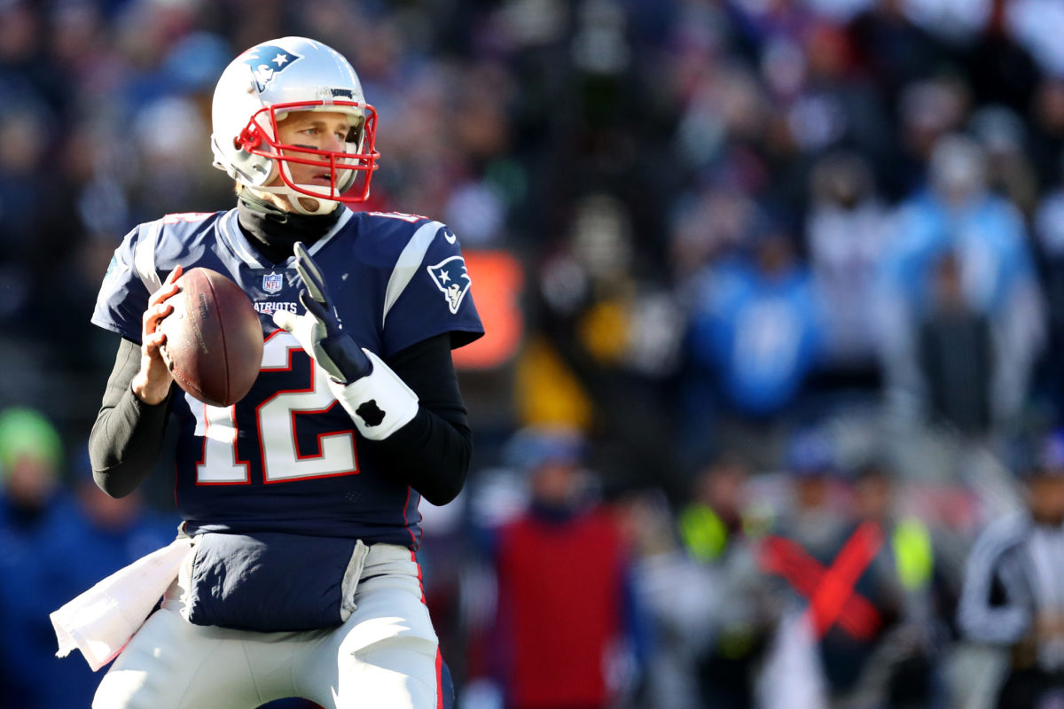 New England Patriots QB Tom Brady dropping back for a pass.
