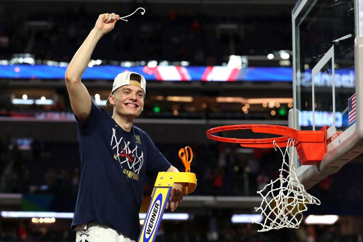 Kyle Guy of Virginia cuts down the nets.