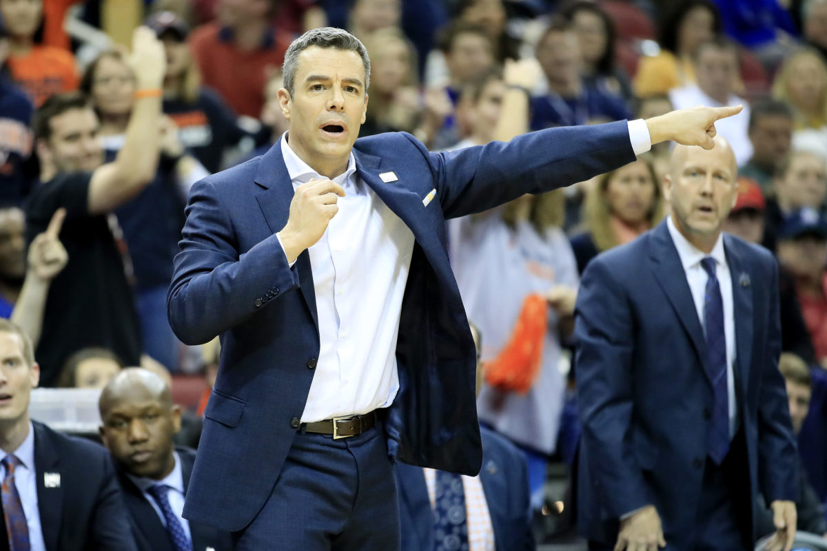 Virginia head coach Tony Bennett points out directions on the sideline.