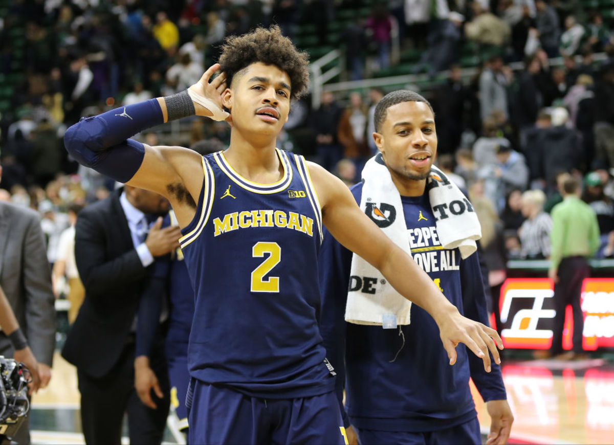Jordan Poole of the Michigan Wolverines celebrates after 82-72 win over the Michigan State Spartans at Breslin Center.