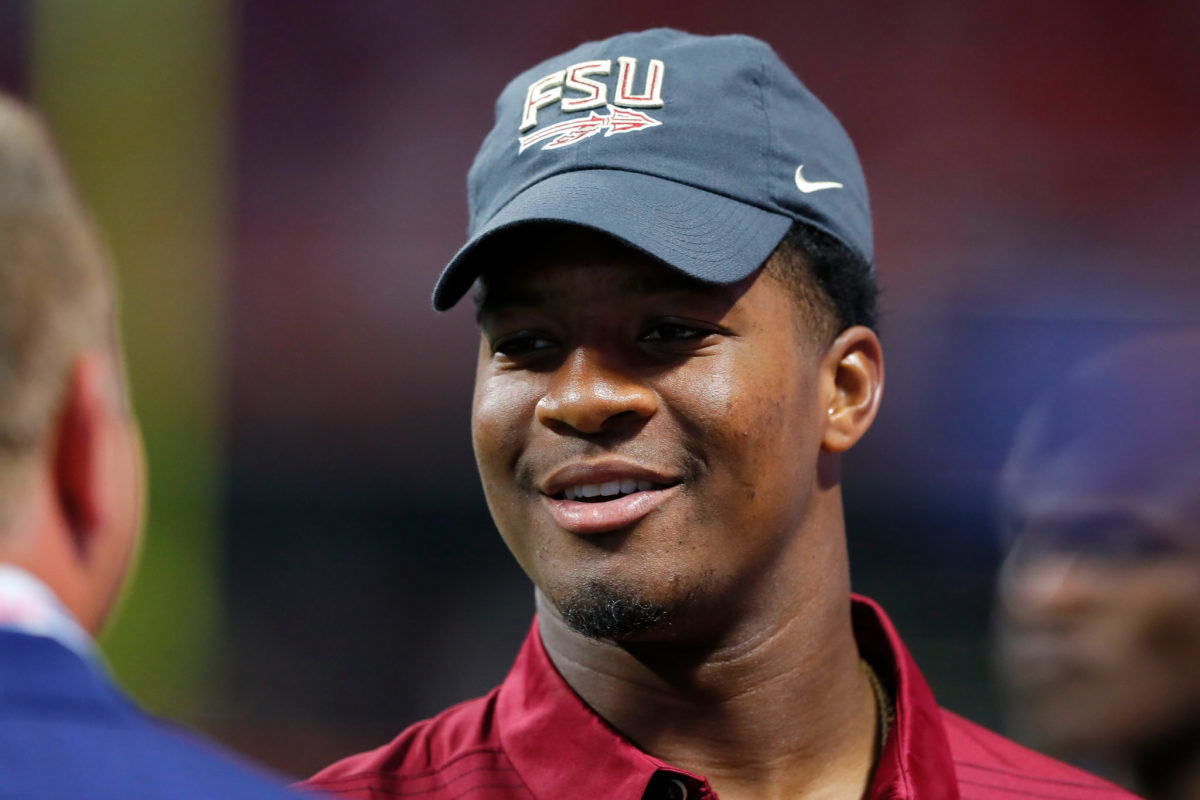 A closeup of Jameis Winston wearing a black Florida State hat.