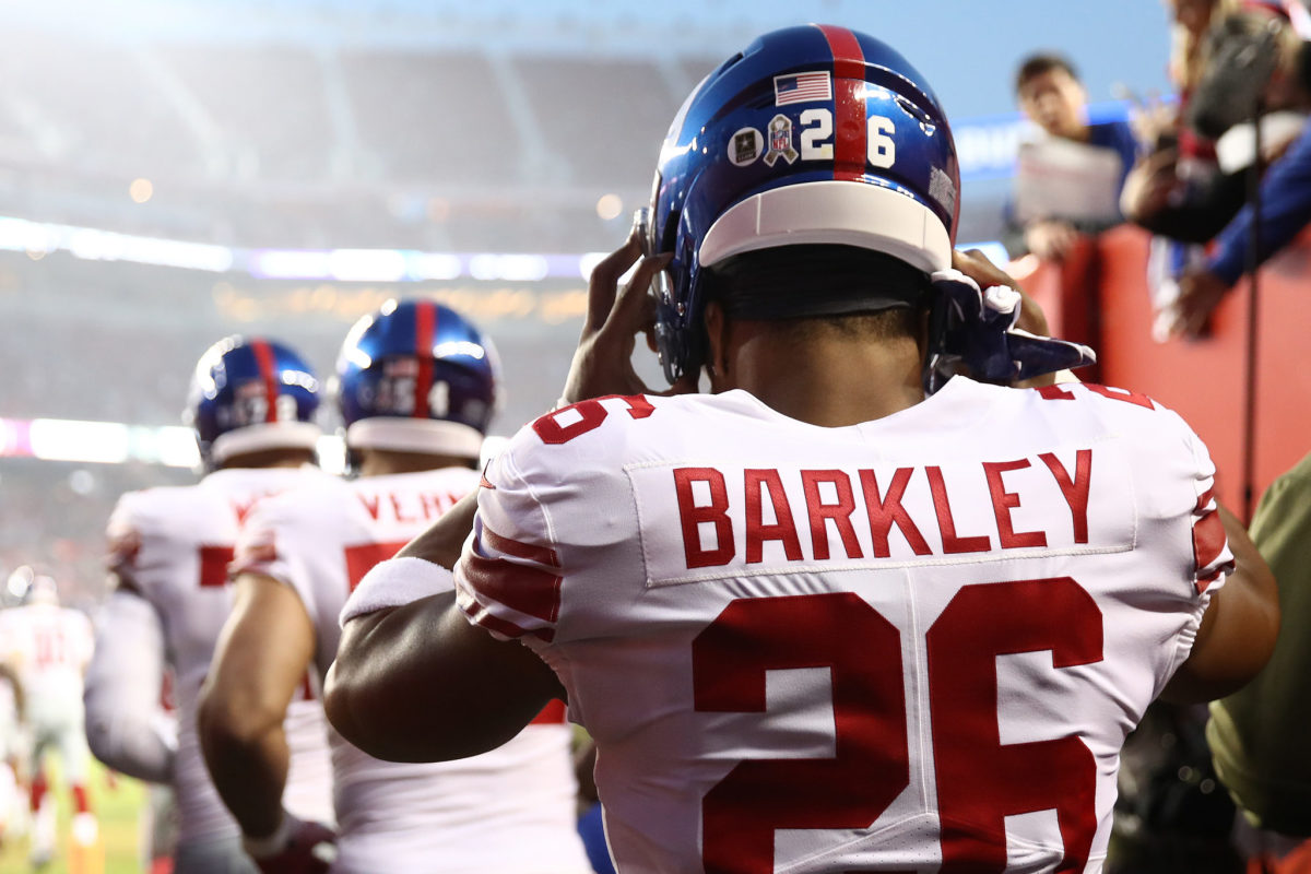 Saquon Barkley walking onto the field for the New York Giants in 2018.