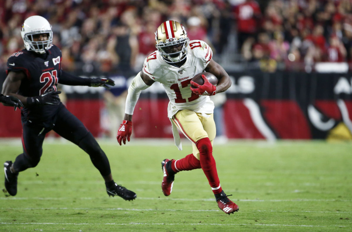 Emmanuel Sanders runs with the football for the San Francisco 49ers.