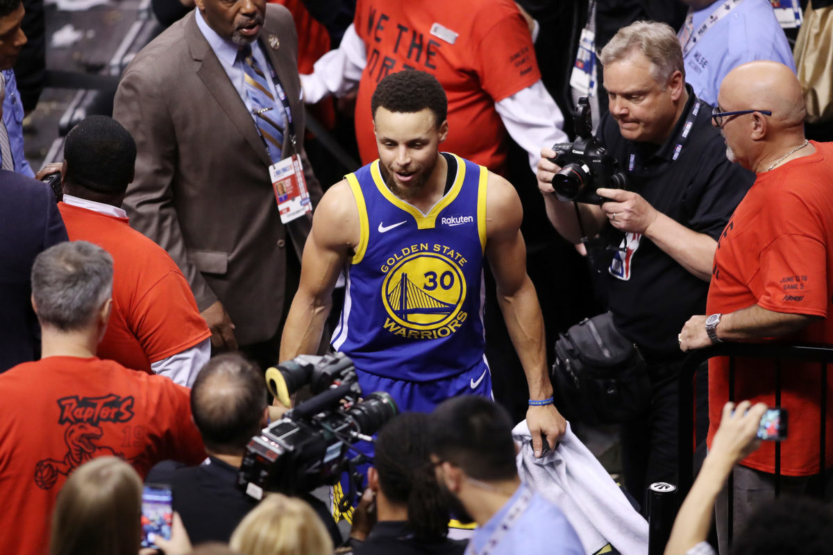 Steph Curry celebrates a win in the NBA playoffs.