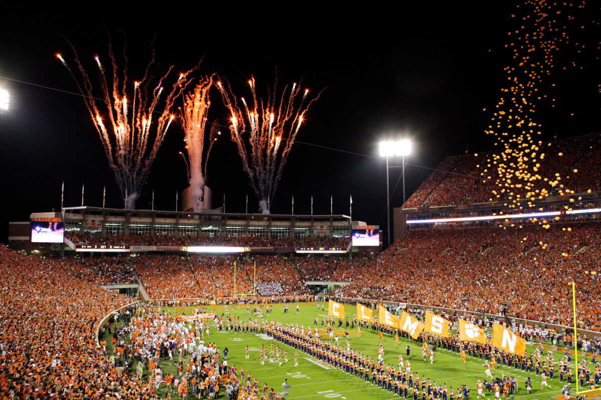 Clemson Tigers runs out onto the field prior to the game against the Louisville Cardinals at Memorial Stadium.