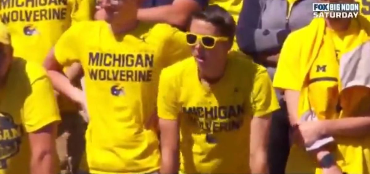 Sad Michigan fans react to a 4th down stop by Army.