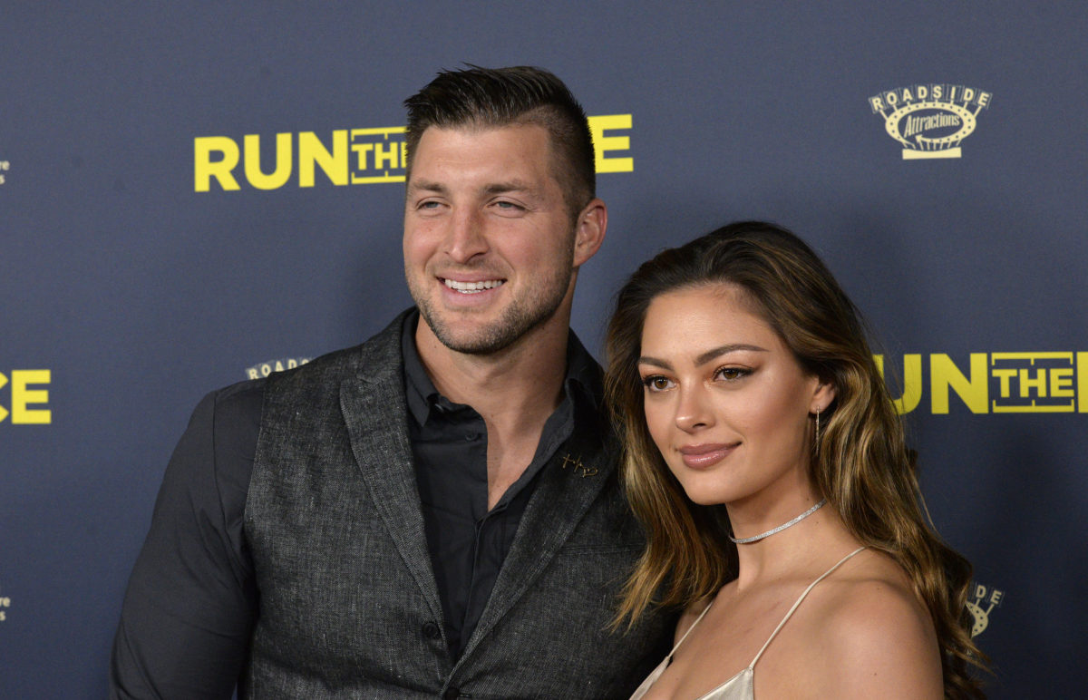 Tim Tebow and Demi-Leigh Nel-Peters pose for a photo.