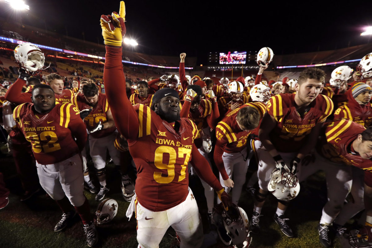 Iowa State football players celebrating a victory.