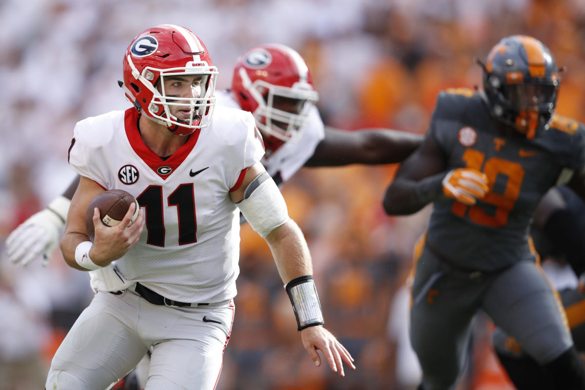 Jake Fromm running the football for Georgia.
