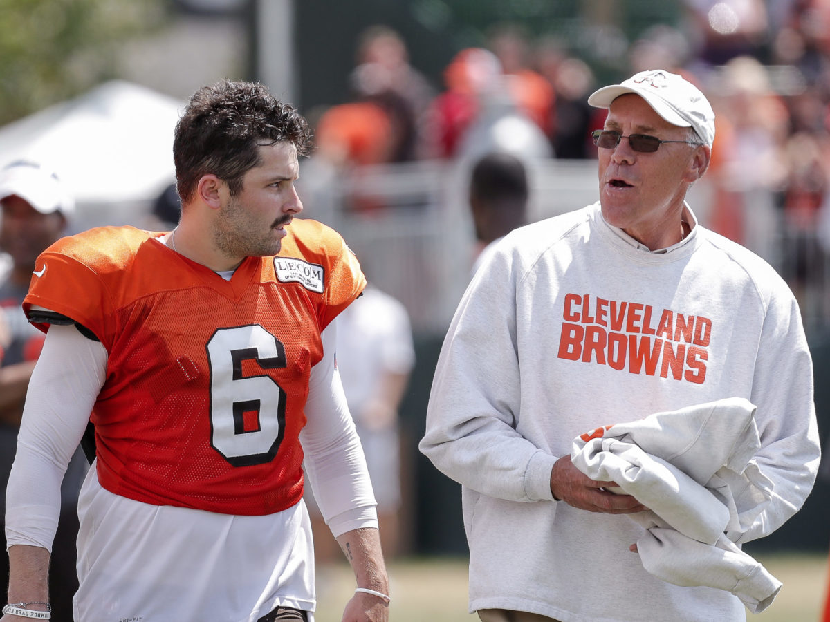Cleveland Browns GM John Dorsey walks and talks with Baker Mayfield during training camp.
