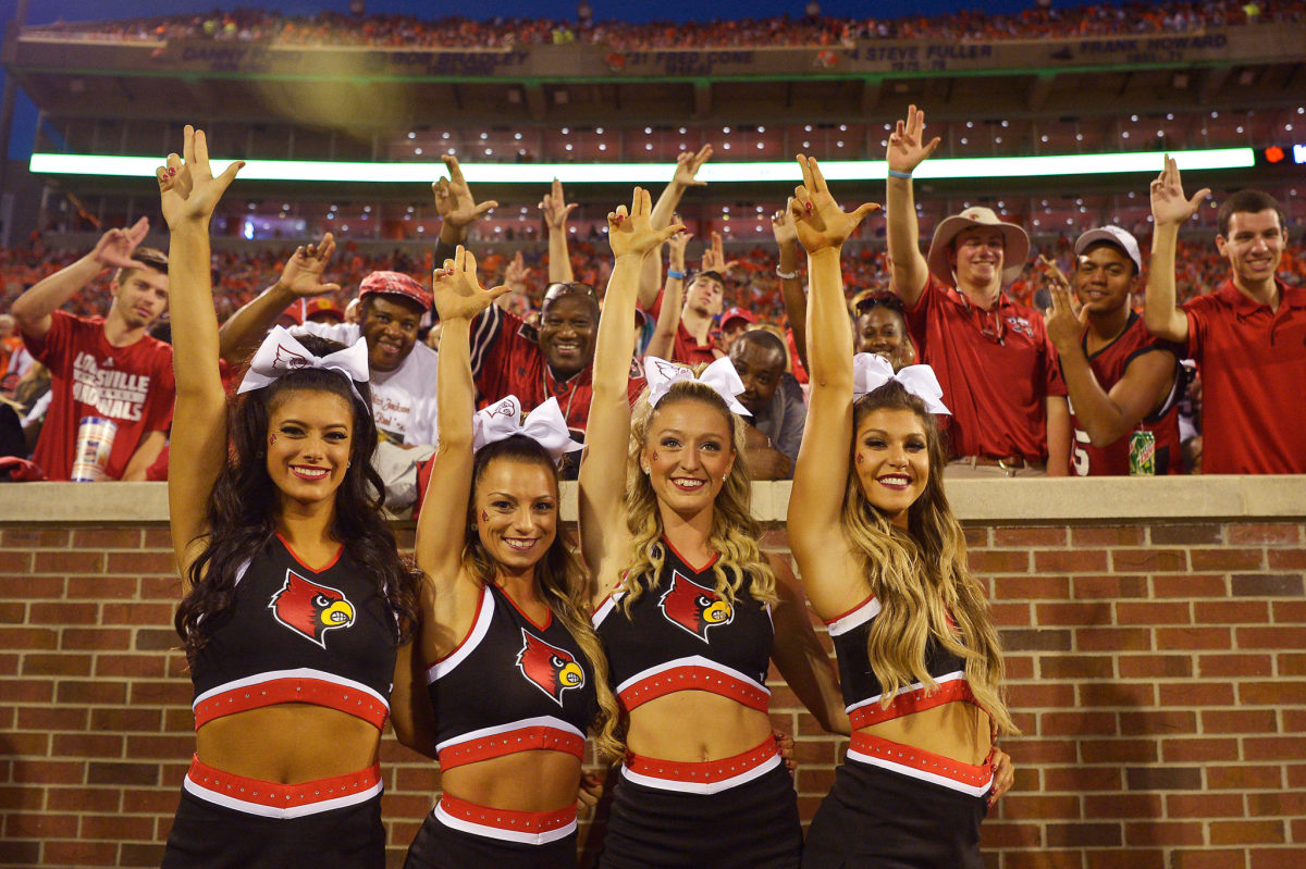 Louisville cheerleaders pose during a game against Clemson.