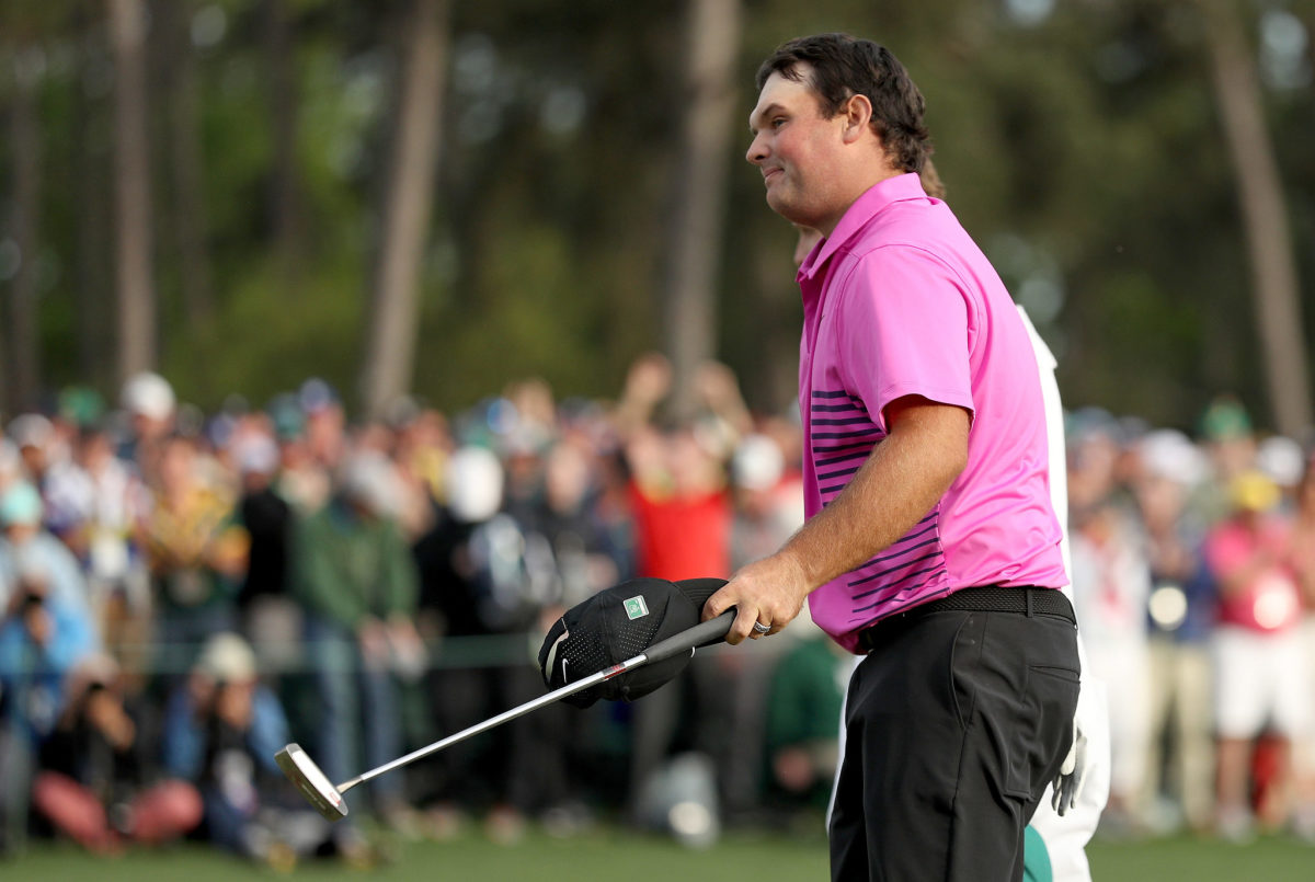 Patrick Reed taking his hat off at the Masters.