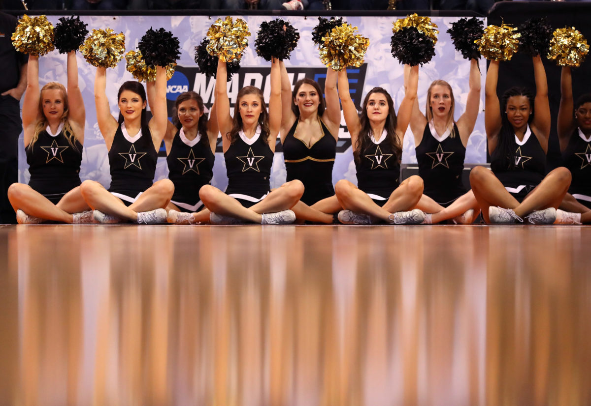 Vanderbilt cheerleaders holding pompoms.