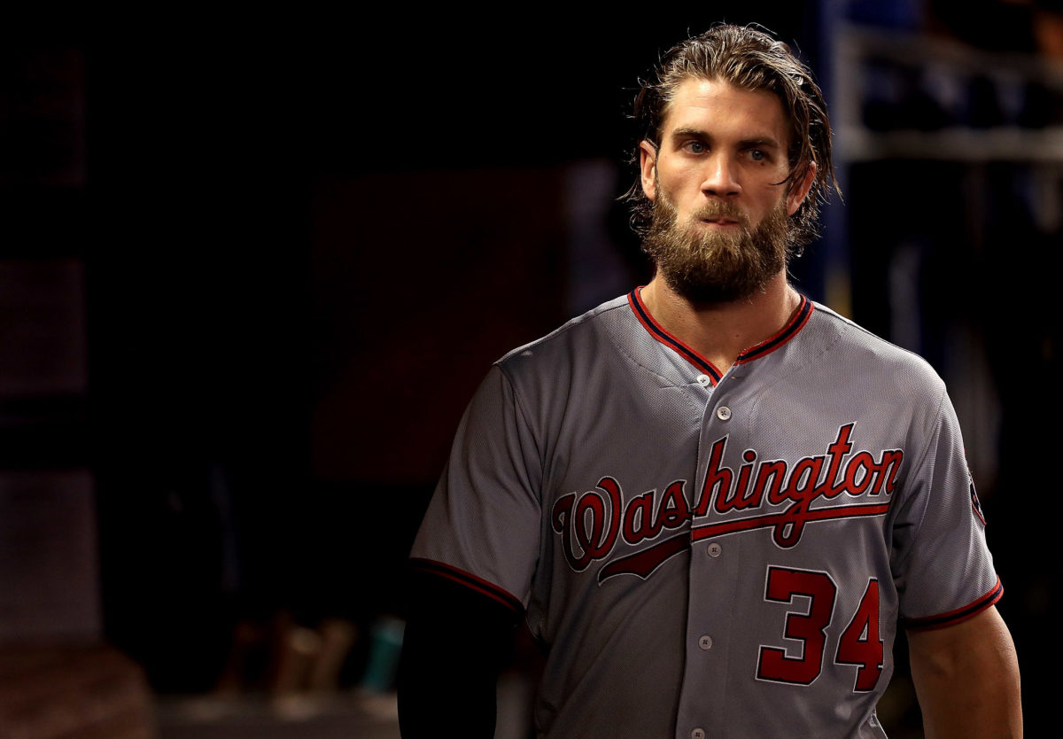 bryce harper walks in the dugout during a game