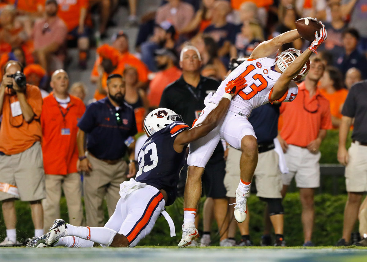 Hunter Renfrow #13 of the Clemson Tigers scores a touchdown during the fourth quarter against Johnathan Ford #23 of the Auburn Tigers at Jordan Hare Stadium.