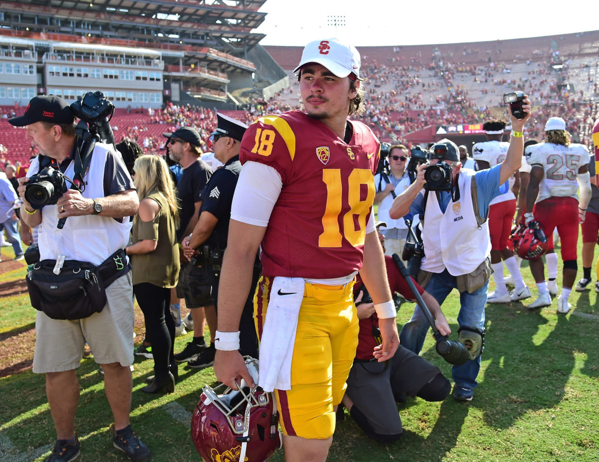 College football star JT Daniels walks off the field at USC. He is now a quarterback for the Georgia football program.