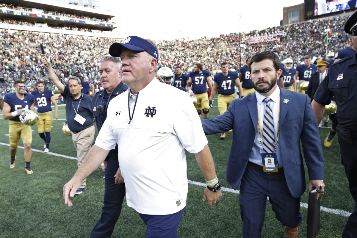 Head coach Brian Kelly of the Notre Dame Fighting Irish leaves the field after a game against the Temple Owls.
