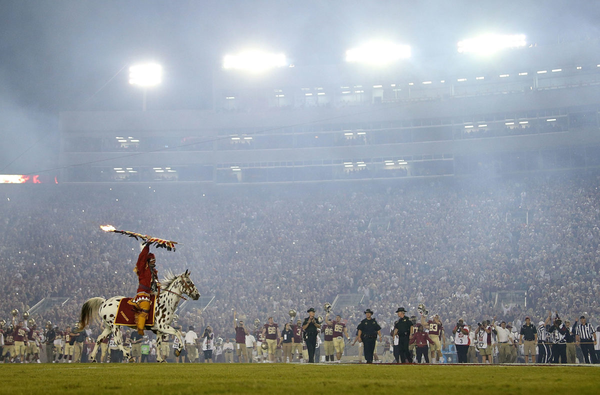 Florida State's mascot running on the field.