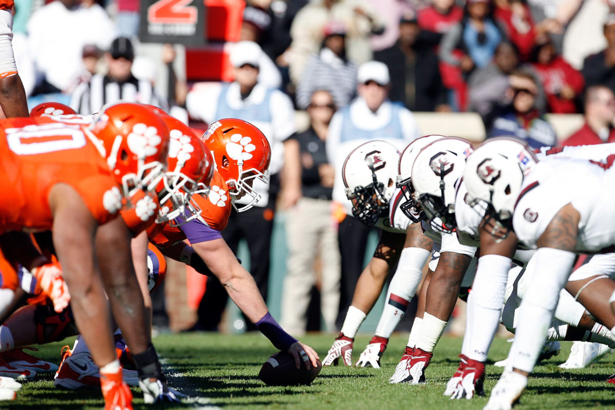 A closeup of the Clemson offensive line lined up across from the South Carolina defensive line.