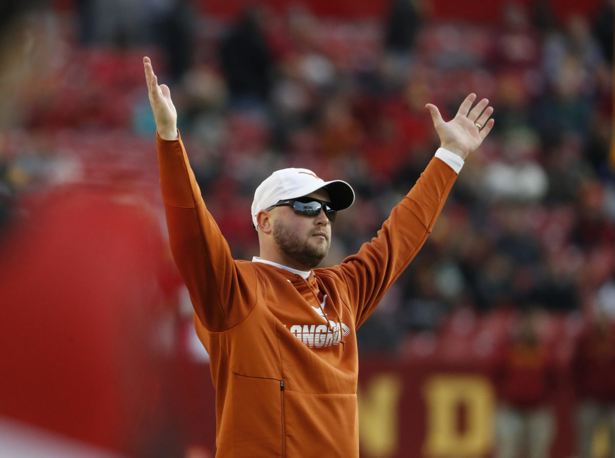 Texas football head coach Tom Herman signals for a touchdown vs. Iowa State.