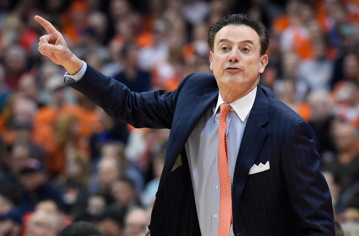 Rick Pitino reacts to a play while coaching Louisville basketball.