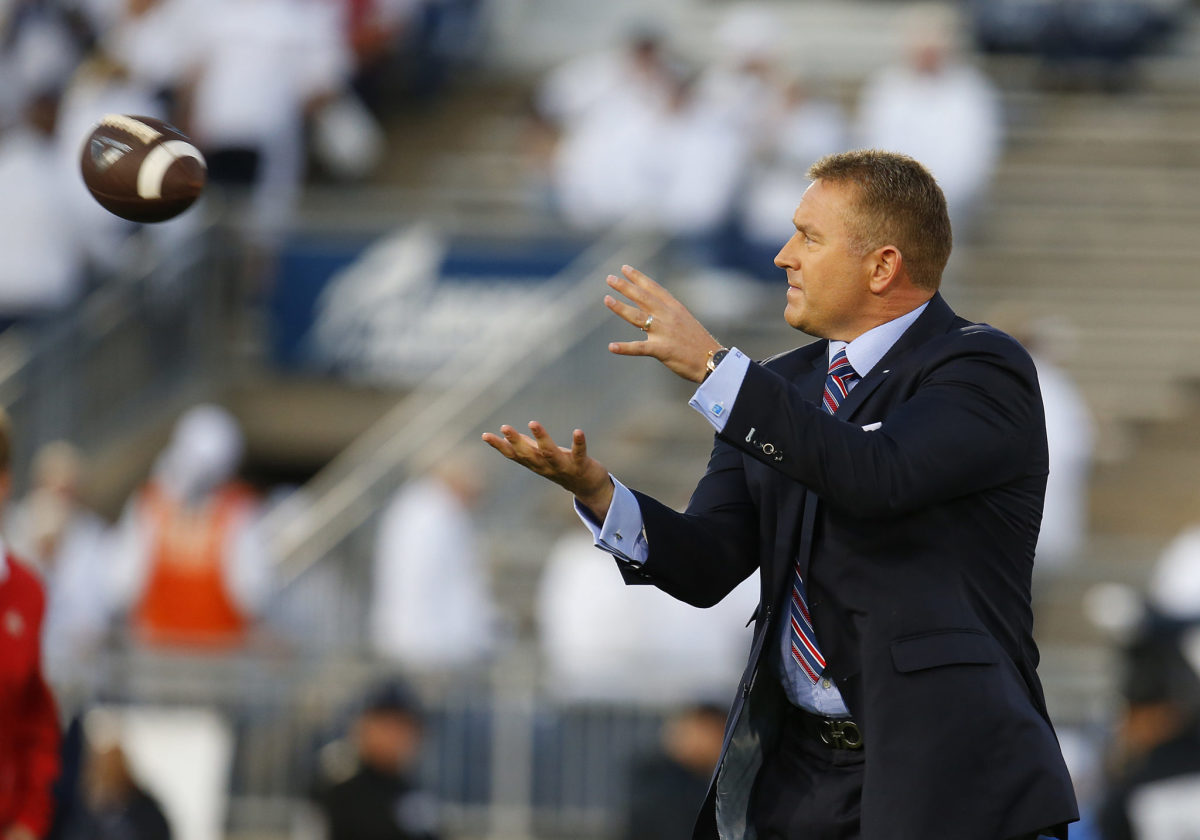 espn's Kirk Herbstreit catches a pass on the field. He recently discussed the upcoming Alabama vs. LSU game. He called his first Monday Night Football game in 2020.