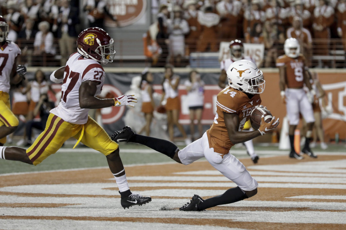 Texas receiver Joshua Moore hauls in a touchdown against USC.