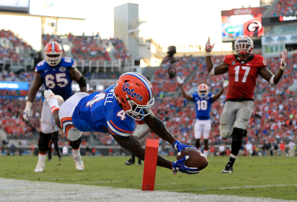 A Florida Gators player diving for the end zone against Georgia. College Football Week 10 is highlighted by this game on Saturday.