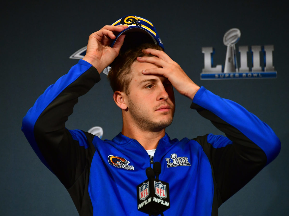 Los Angeles Rams QB Jared Goff wipes his forehead at Super Bowl media day.