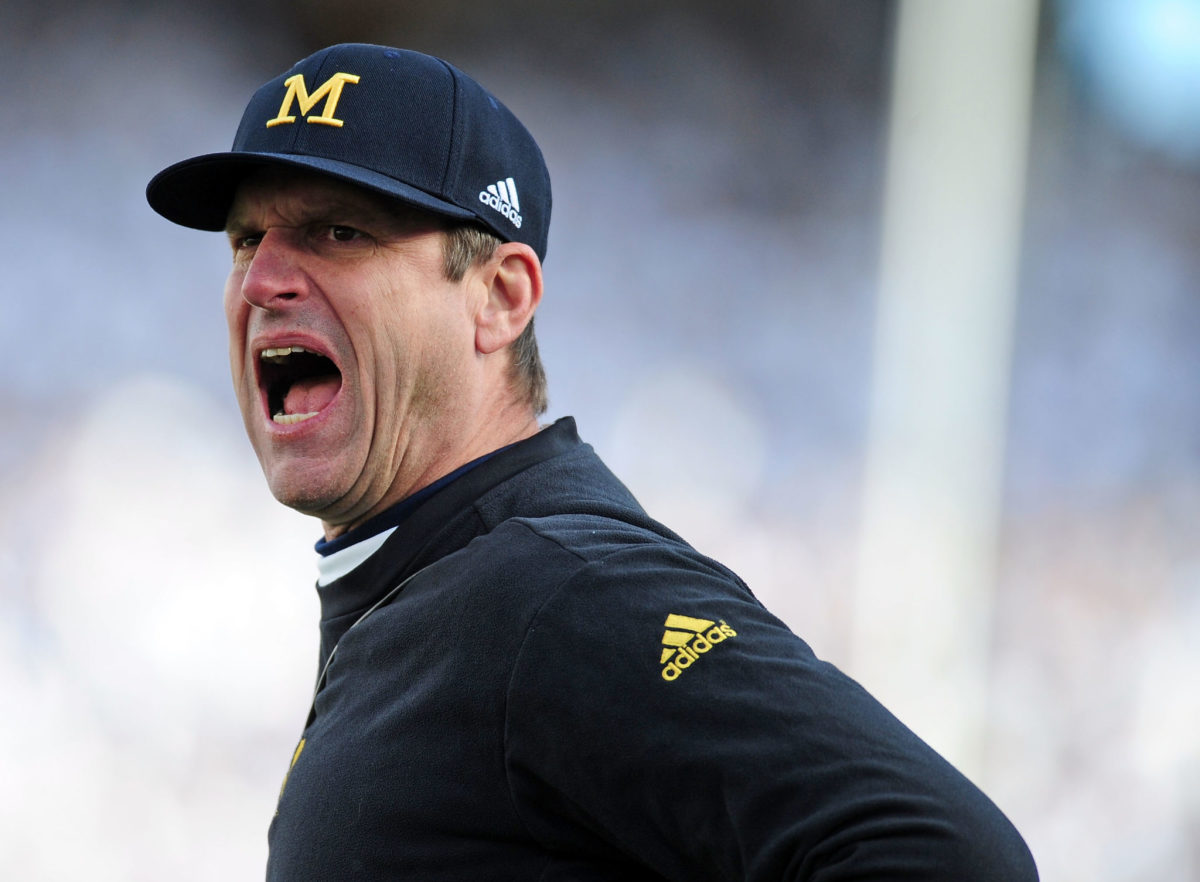 Jim Harbaugh head coach of the Michigan Wolverines shouts during the game against the Penn State Nittany Lions.