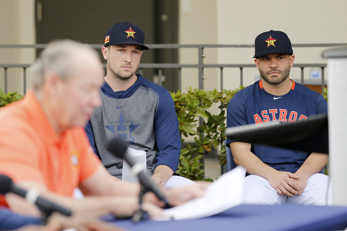 Jose Altuve and Alex Bregman look on as Houston Astros owner Jim Crane gives press conference about cheating scandal.