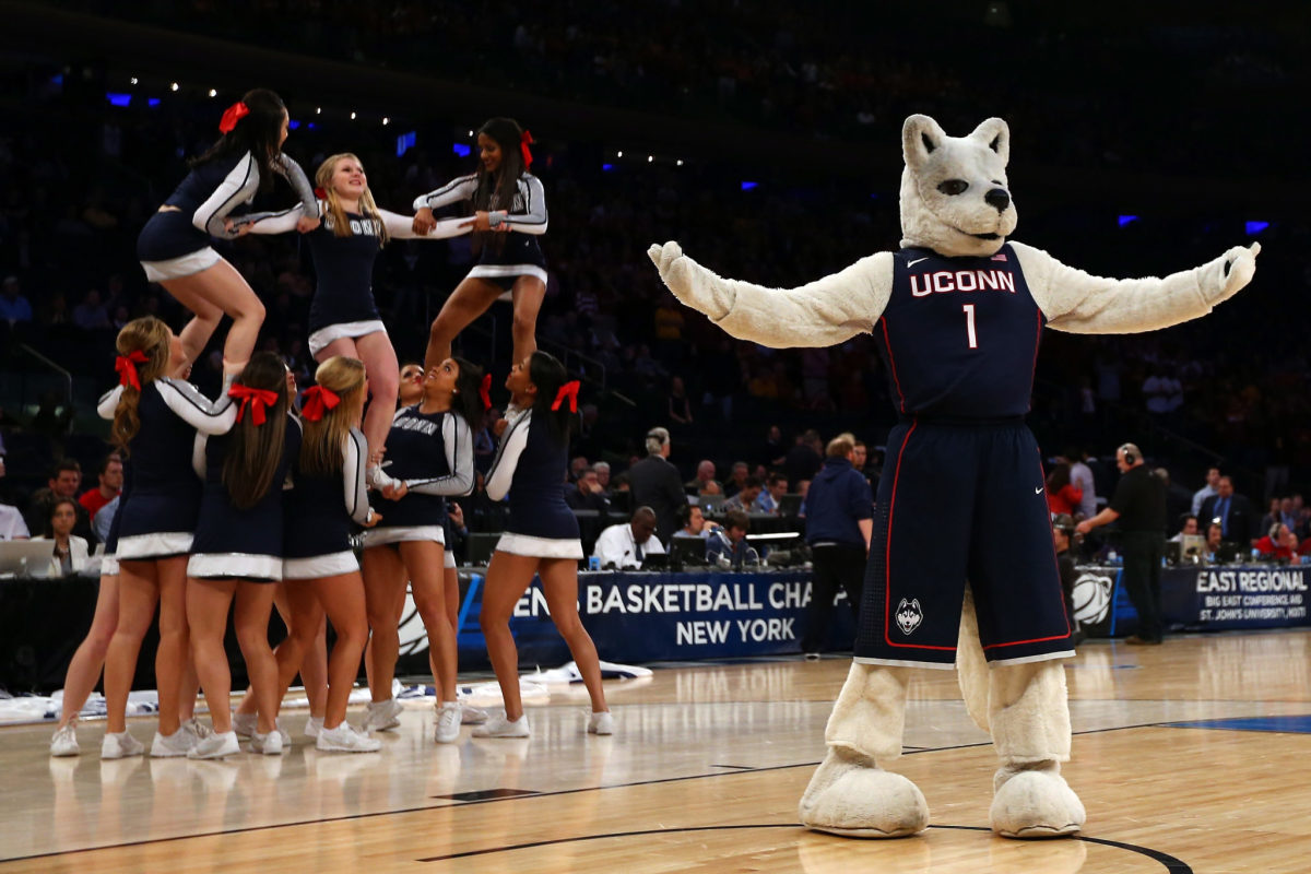 UConn's mascot and cheerleaders during a timeout.