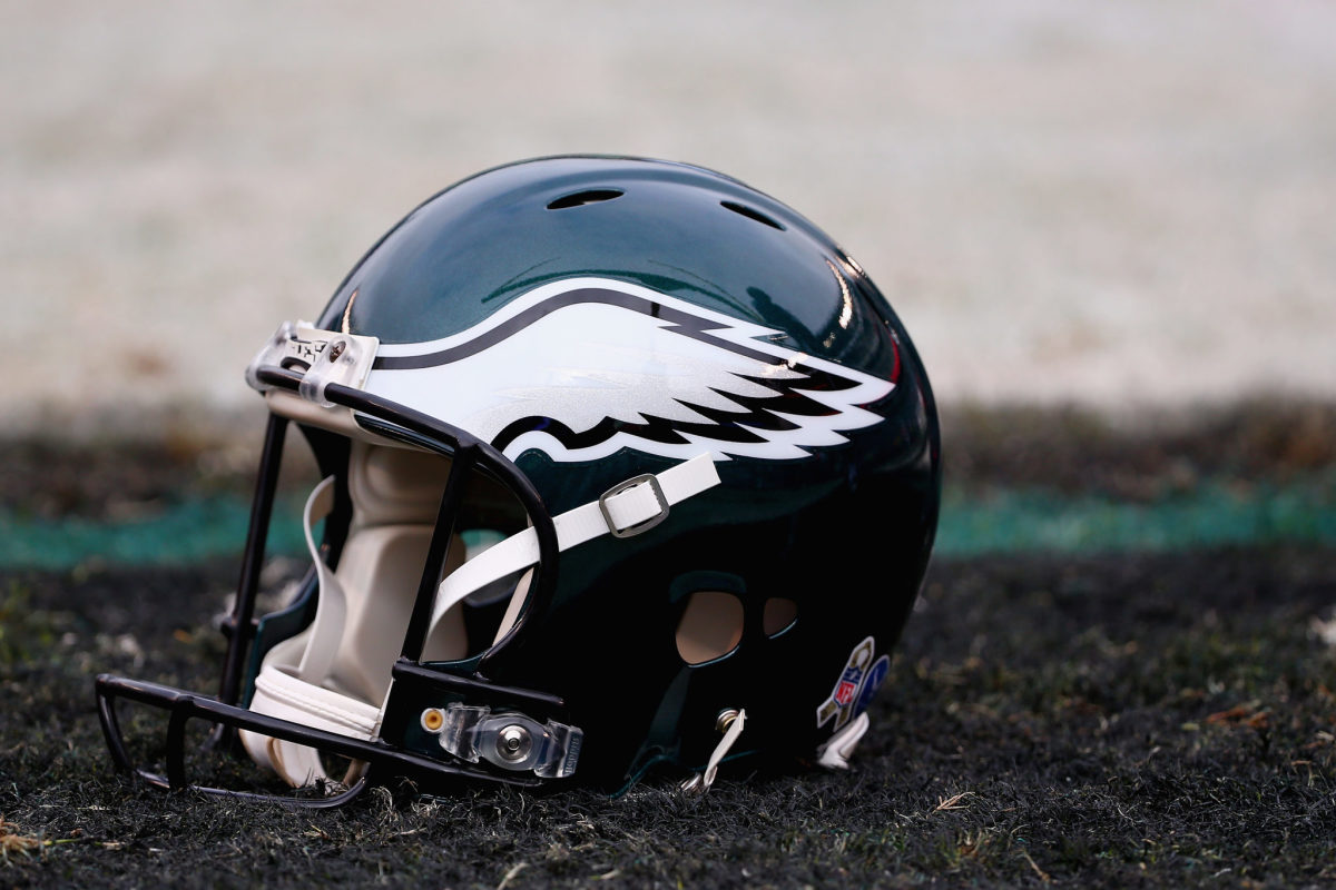 A Philadelphia Eagles helmet sitting on the field.