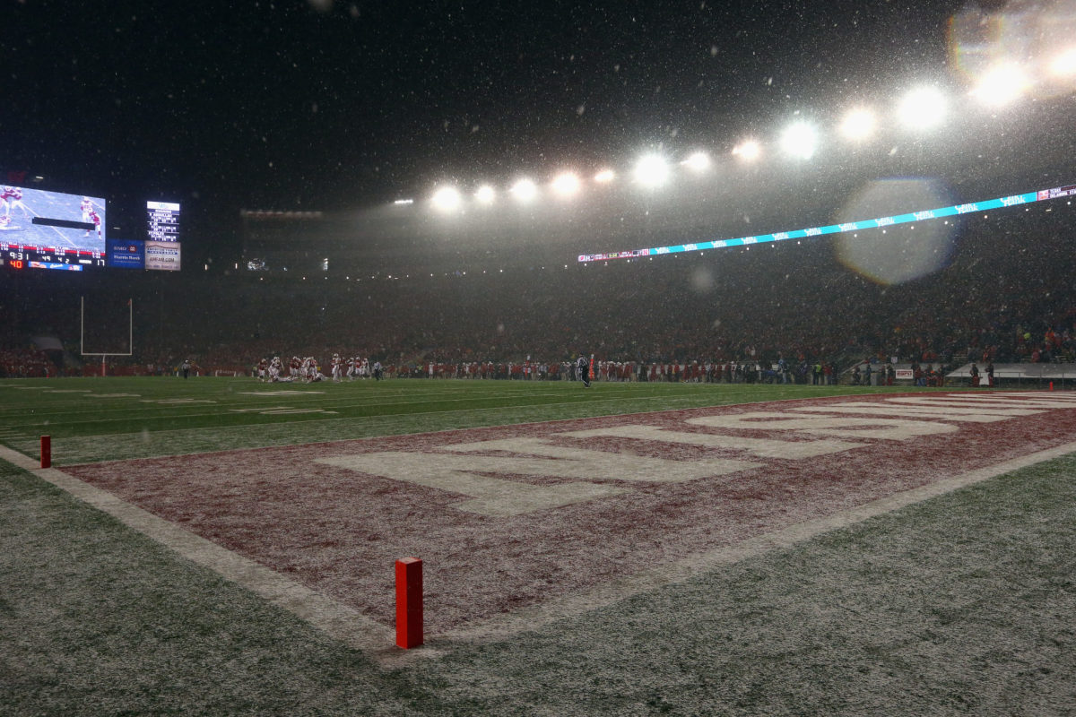 Wisconsin's stadium with snow on the field.